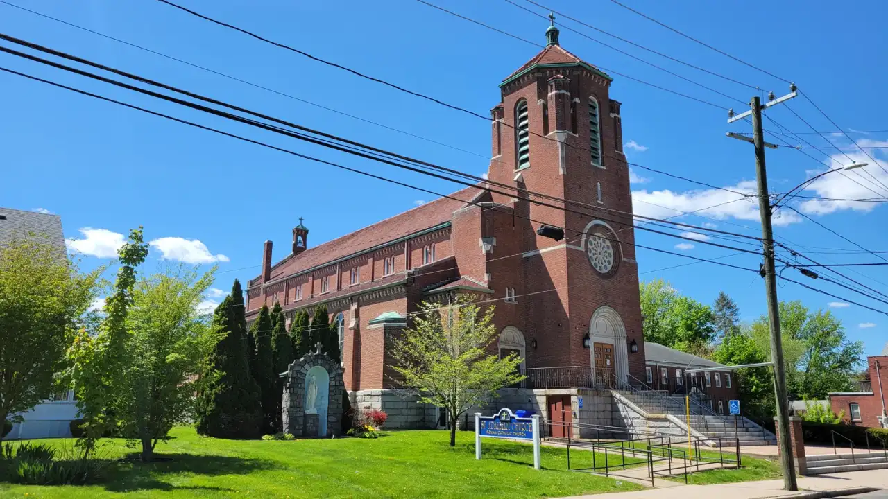 St. Adalbert Church, a brick Catholic church with a tall bell tower, in the Thompsonville section of Enfield, Connecticut