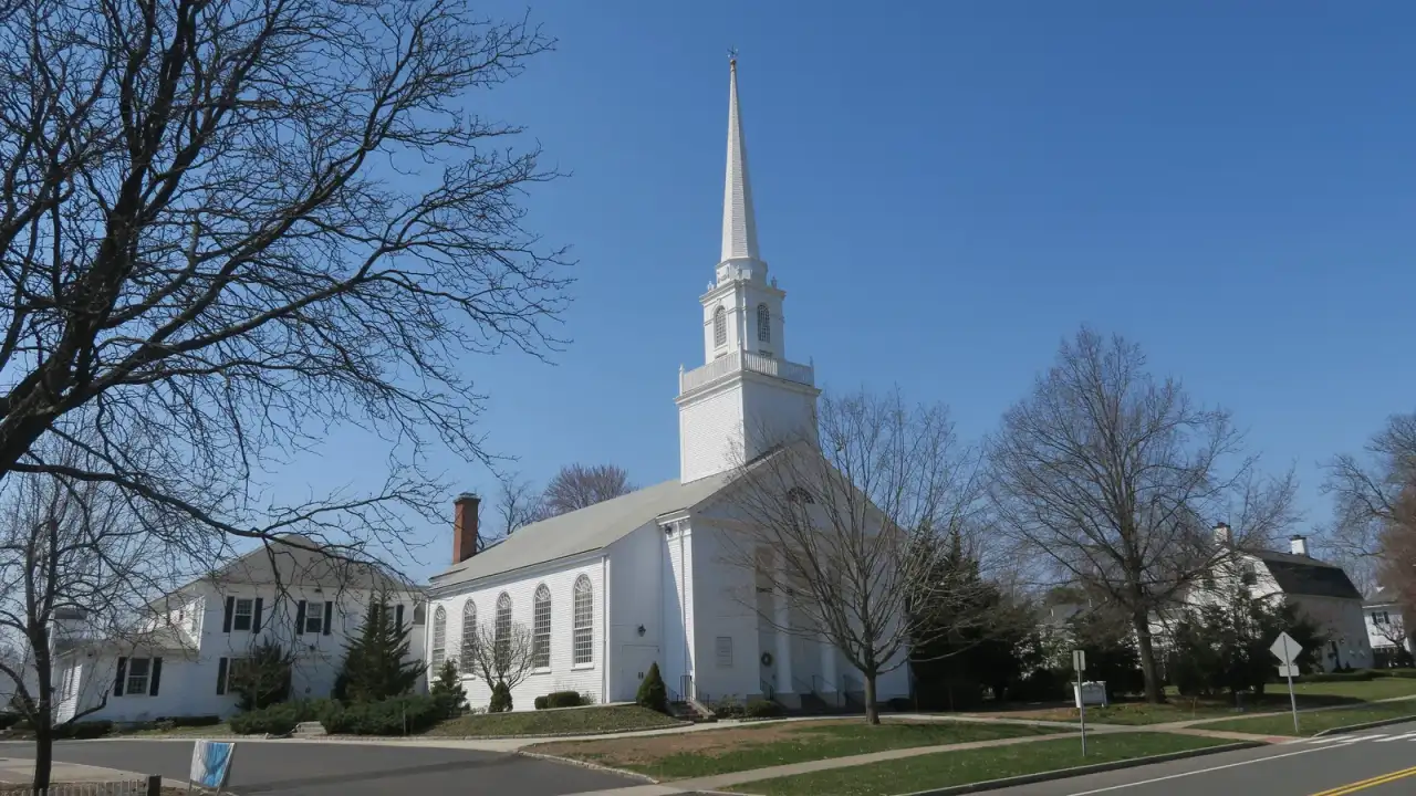 The First Church of Christ, a white colonial meetinghouse with a tall steeple, in Glastonbury, Connecticut